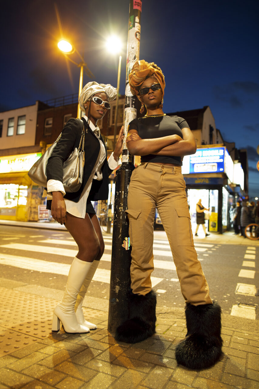 Two models wearing a mixture of British and African clothing in London, Peckham Rye.